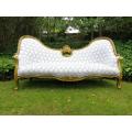 A 20th century, Victorian-style Gilt-painted Carved settee