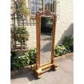 A Cheval Gilded Floor Standing Mirror With Bevelled Mirror Hand-Gilded With Gold Leaf R16800