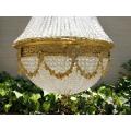 A Large Antique Gold Beaded Empire Style Chandelier
