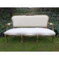 A 20th Century Carved And Hand-Gilded French Style Settee Upholstered In An Imported Linen