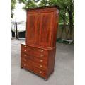 A Mid 19th Century Victorian Mahogany Secretaire. The interior fitted with a gilt-tooled green le...