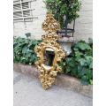 A 20th Century French Style Ornately Carved and Gilt Painted Wooden Mirror