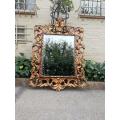 An Early 20th Century Spanish Carved Gilt Painted Wooden Bevelled Mirror