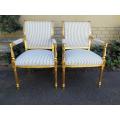 A Pair Of Carved And Gilded Armchairs