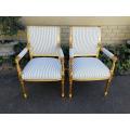 A Pair Of Carved And Gilded Armchairs