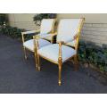 A Pair Of Carved And Gilded Armchairs