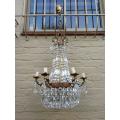A 20th Century French Style Empire Brass and Crystal Chandelier