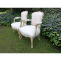 A Pair of 20th Century French Rococo Style Oak Armchairs in a bleached / natural finish