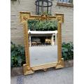 A Highly Carved and Ornate French-style Gilt and Bevelled Mirror