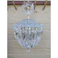 A French Style Brass and Crystal Plate Chandelier with Floral top