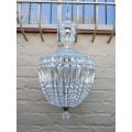 A French Style Brass and Crystal Plate Chandelier with Floral Top