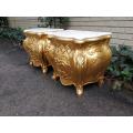 A Pair of French Style Ornately Carved Bombe Giltwood Pedestals/Side Tables with Marble Tops