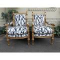 A Pair Of 20th Century Carved Wooden And Gilt-Painted Armchairs