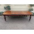 A 19th Century Late Victorian Mahogany Extending Dining Table on Brass Castors with Crank Handle