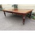 A 19th Century Late Victorian Mahogany Extending Dining Table on Brass Castors with Crank Handle