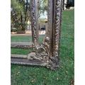 An Ornate Carved Rococo French Style Bevelled Mirror