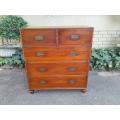 A Late 19th Century Brass Bound Teak & Mahogany Military Campaign Chest Of Drawers On Bun Feet