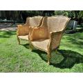 A 20th Century Pair of French Style Rattan Hand Gilded Wing Back Chairs