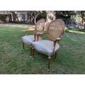 A Pair of 20th Century French Style Rattan-Back Gilded Arm Chairs
