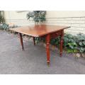 An Early 20th Century Mahogany Pembroke Table On Turned Legs