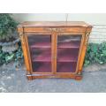 A Victorian Walnut Credenza / Display Cabinet With Gilt Mounts And Glazed Doors With Shelves On B...