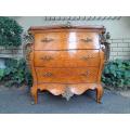 A 20th Century French Style Bombe Chest Of Drawers With Marble Top And Gilt Mounts
