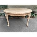 A 20th Century Heavily Carved Round Table in a Contemporary Bleached Finish with Bevelled Mirro...