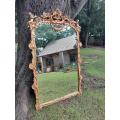 A French Rococo Style Ornately Carved and Gilded Bevelled Mirror 1