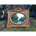 A French Rococo Style Ornately Carved and Gilded Bevelled Mirror 2