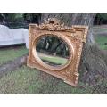 A French Rococo Style Ornately Carved and Gilded Bevelled Mirror 2
