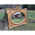 A French Rococo Style Ornately Carved and Gilded Bevelled Mirror 4