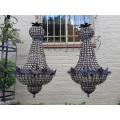 A French Style Pair of Gilt Aged Monumental Empire Chandeliers