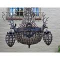 A French Style Aged Monumental Empire Style Chandelier with Deer Head Figures