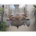 A Brass Gilt & Aged Monumental Empire French Style Chandelier with Deer Head Figures