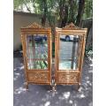A Pair of French Louis XVI Style Ornately Carved & Gilded Showcases
