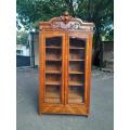 A 19th Century French Rococo Style Bookcase with Bevelled Glass, Shelves and Two Drawers