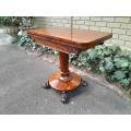 A 19TH Century William IV Rosewood Fold-over Card Table With Paw Feet