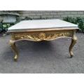 A 20th Century French Baroque Style Gilded Coffee Table with Cream Marble Top