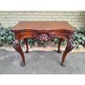 An Antique Jacobean Ornately Carved Oak Card Table with Black Baize