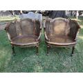 A French Louis XVI Style Pair of Ornately Carved Giltwood Rattan Bergere Chairs