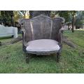 A French Louis XVI Ornately Carved Giltwood Rattan Bergere Chair