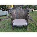 A French Louis XVI Ornately Carved Giltwood Rattan Bergere Chair
