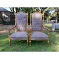 A Pair of French Large Rococo Style Orntely Carved and  Giltwood Ornate Arm Chairs on Fluted legs