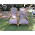 A Pair of French Large Rococo Style Orntely Carved and  Giltwood Ornate Arm Chairs on Fluted legs
