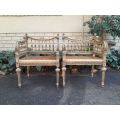A 20th Century French Style Pair of Ornately Carved and Rattan Arm Chairs