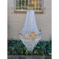 A French Empire Style Brass & Crystal Chandelier