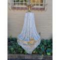 A French Empire Style Brass & Crystal Chandelier