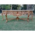 A 20th Century Ornately Carved and Hand-Gilded Console Table of Large Proportion with Cream Marbl...
