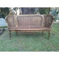 A French Louis XVI Style Carved and Giltwood Rattan Settee