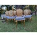 A Set of Eight (8) Gilded French Rattan Ornately Carved Balloon-Back Chairs